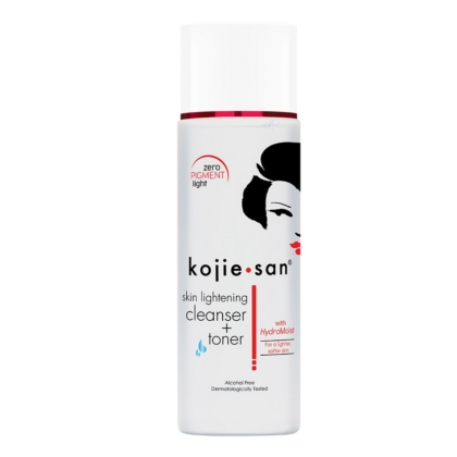 Un flacon de Kojie San Lotion Double Action Uniformisante Anti-imperfections 100 ml de couleur blanche, avec un texte rouge et noir, un visage de femme en silhouette noire et un logo rouge. Ce produit sans alcool est testé dermatologiquement pour tous les types de peau. Dakar