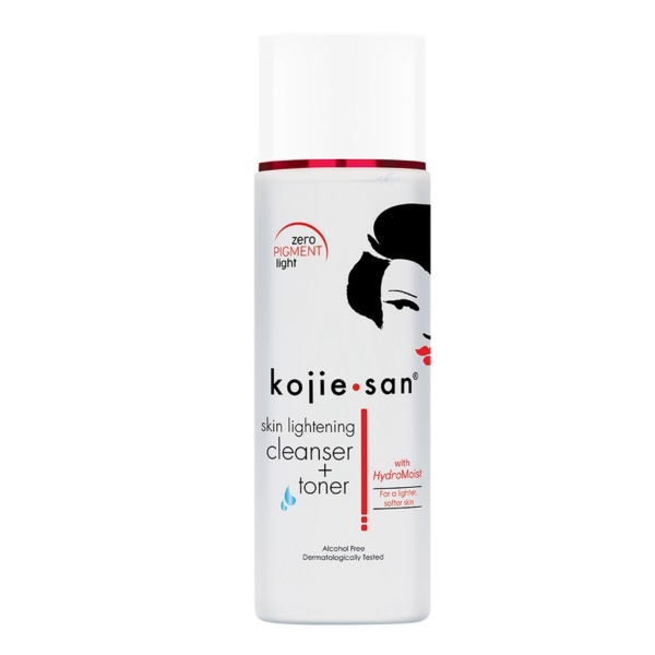 Un flacon de Kojie San Lotion Double Action Uniformisante Anti-imperfections 100 ml de couleur blanche, avec un texte rouge et noir, un visage de femme en silhouette noire et un logo rouge. Ce produit sans alcool est testé dermatologiquement pour tous les types de peau. Dakar