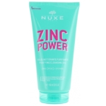 Un tube turquoise de Nuxe Zinc Power Gelée Nettoyante Purifiante (150 ml) contient une formule « Zinc Power Sérum Anti-Imperfections Anti-Boutons » surlignée en texte rose, avec « Zinc [PCA] + Litchi », conçue pour les peaux mixtes à tendance acnéique. Dakar