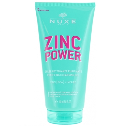 Un tube turquoise de Nuxe Zinc Power Gelée Nettoyante Purifiante (150 ml) contient une formule « Zinc Power Sérum Anti-Imperfections Anti-Boutons » surlignée en texte rose, avec « Zinc [PCA] + Litchi », conçue pour les peaux mixtes à tendance acnéique. Dakar