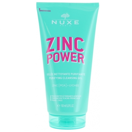 Un tube turquoise de Nuxe Zinc Power Gelée Nettoyante Purifiante (150 ml) contient une formule « Zinc Power Sérum Anti-Imperfections Anti-Boutons » surlignée en texte rose, avec « Zinc [PCA] + Litchi », conçue pour les peaux mixtes à tendance acnéique. Dakar