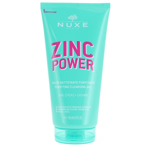 Un tube turquoise de Nuxe Zinc Power Gelée Nettoyante Purifiante (150 ml) contient une formule « Zinc Power Sérum Anti-Imperfections Anti-Boutons » surlignée en texte rose, avec « Zinc [PCA] + Litchi », conçue pour les peaux mixtes à tendance acnéique. Dakar