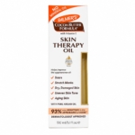 Une boîte blanche contenant l'huile « Skin Therapy Oil » de Palmers, « Huile Réparatrice pour le Corps » de 150 ml, enrichie en vitamine E, destinée au traitement des cicatrices, des vergetures, de la peau sèche, du teint irrégulier et des signes de vieillissement cutané. Le produit est « sans huile minérale » et prétend réduire l'apparence des cicatrices de 93 %. Dakar
