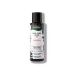 Un flacon d'huile de jojoba 100 % pure Activilong pour les cheveux et le corps. L'étiquette, ornée de motifs de feuilles tropicales, indique qu'elle maintient l'hydratation, nourrit et protège. Le flacon est foncé avec un bouchon noir. Dakar