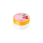 Un petit pot blanc au couvercle jaune vif, portant l'étiquette « Masque Lèvres Quotidien A’pieu Miel & Lait » au parfum de fruits rouges. L'étiquette présente des illustrations de cerises et d'une cuillère à miel. Dakar