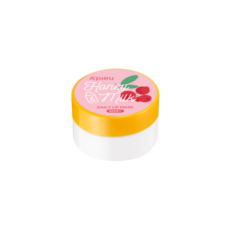 Un petit pot blanc au couvercle jaune vif, portant l'étiquette « Masque Lèvres Quotidien A’pieu Miel & Lait » au parfum de fruits rouges. L'étiquette présente des illustrations de cerises et d'une cuillère à miel. Dakar