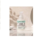 Une Crème fluide purifiante et hydratante BIO Aroma Zone de 50 ml est posée sur une surface réfléchissante. Des étiquettes vertes et blanches, ornées d'un texte élégant, sont disposées à côté d'un miroir circulaire, créant une esthétique minimaliste et sereine. Dakar