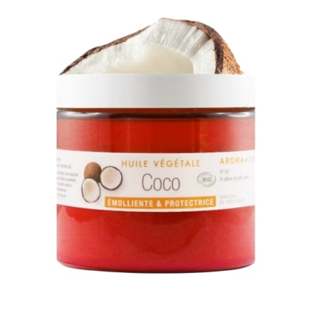Un pot d'Aroma Zone Huile de Coco BIO 100 ml, étiqueté « Huile Végétale Coco, Émolliente & Protectrice », comporte un couvercle blanc et une moitié de noix de coco posée dessus. Dakar
