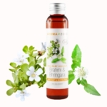 Une bouteille brune étiquetée « Aroma Zone Huile de Brahmi et Bhringaraj BIO » se dresse au milieu de feuilles et de fleurs luxuriantes de Brahmi et de Bhringaraj, aux côtés d'Aroma Zone Huile de Moutarde BIO, promettant une expérience d'huile fortifiante et revitalisante. Dakar