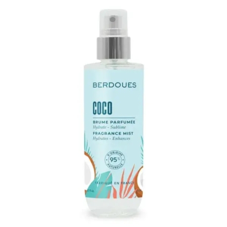 La brume hydratante parfumée Coco BERDOUES (200 ml) arbore une étiquette turquoise clair ornée d'illustrations de noix de coco, de feuilles de palmier et d'agrumes. Sa formule 95 % naturelle est dotée d'un vaporisateur pratique pour une hydratation facile. Dakar