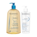 Un grand flacon d'huile de douche Bioderma Atoderm, avec une pompe bleue, côtoie un flacon de gel-crème Bioderma Atoderm Intensive, avec une pompe blanche. Tous deux présentent un texte détaillant leurs bienfaits et sont conçus pour les peaux sensibles. Dakar
