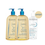 Deux flacons d'huile de douche Bioderma Atoderm Ultra-Nourrissante Anti-Irritations (pompes bleues) et un flacon d'Atoderm Gel-Crème Intensif (pompes blanches). Le mot « OFFERT » est inscrit dans un cercle beige en haut à droite. Dakar