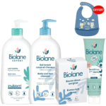 Un ensemble de produits Biolane comprenant un lait corporel, un nettoyant corps et cheveux, un savon extra-riche, un dentifrice et un bavoir bébé bleu. Les étiquettes arborent des éléments naturels et des symboles soulignant le respect de l'environnement et le soin des nourrissons. Dakar