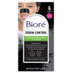 Emballage des bandes nasales Bioré Sébum Control Pore Strips, représentant une personne souriante portant un patch. La boîte contient un texte en français sur le charbon purifiant et le débouchage des pores. Dakar