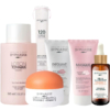 Une collection de soins Byphasse, comprenant une lotion, un tonique liquide, des disques de coton, un exfoliant, un masque visage, une crème illuminatrice et un sérum à la vitamine C. L'emballage présente des tons orange, rose et blanc. Dakar