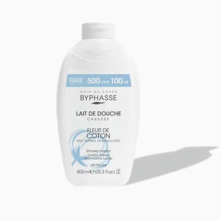Un flacon blanc de crème douche Byphasse, étiqueté « Lait de Douche » et parfumé « Fleur de Coton ». Son étiquette bleu clair et blanche indique un format de 600 ml avec un supplément de 100 ml. Une ombre apparaît sur sa droite. Dakar