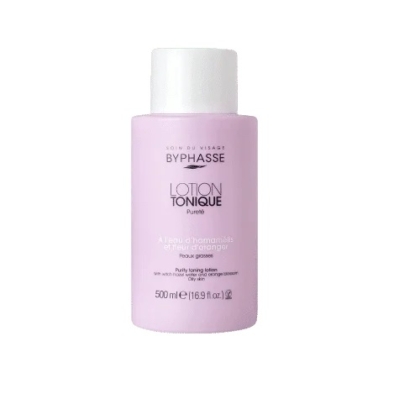 Un flacon rose de Lotion Tonique Bypassé de 500 ml, avec un bouchon et un texte blancs. L'étiquette indique qu'il s'agit d'une lotion tonique purifiante à l'hamamélis et à la fleur d'oranger, pour les peaux grasses. Dakar