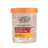 Un pot de 524 g de gel coiffant fortifiant au beurre de karité Cantu à l'huile de ricin noire de Jamaïque. L'emballage est transparent avec un couvercle orange et les informations produit sont en vert et rouge. Dakar