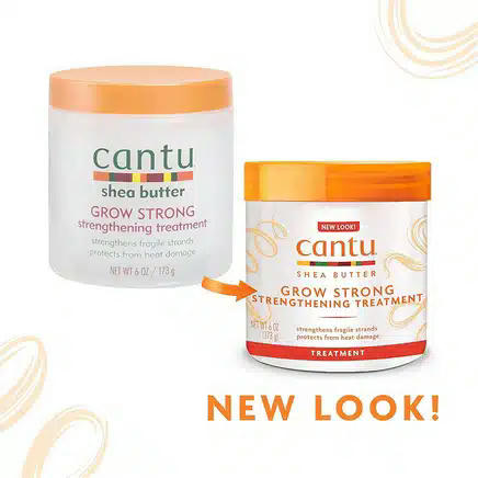 Deux contenants de soin fortifiant Cantu au beurre de karité Grow Strong. À gauche, un ancien modèle avec un bouchon pastel ; à droite, un emballage modernisé avec une étiquette blanche et orange, surmontée du texte « Nouveau look ! ». Dakar