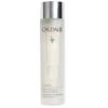 Un flacon translucide d'Essence Glycolique Concentrée Éclat Vinoperfect de Caudalie, avec un bouchon argenté. L'étiquette affiche le nom de la marque, un logo en forme de vigne et les informations produit en français et en anglais. Dakar