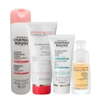 Quatre produits de soin du Laboratoire Château Rouge, dont une lotion rafraîchissante, un gel moussant, un gel sorbet unifiant et un sérum spécifique pour les zones ciblées, sont disposés côte à côte sur un fond blanc. Dakar