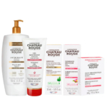 Une collection de soins du Laboratoire Château Rouge, comprenant un grand flacon pompe de lait corporel, un gel moussant, un sérum éclat, une crème exfoliante et un savon dermatologique. Tous sont présentés dans un emballage blanc avec inscription rouge et noire. Dakar