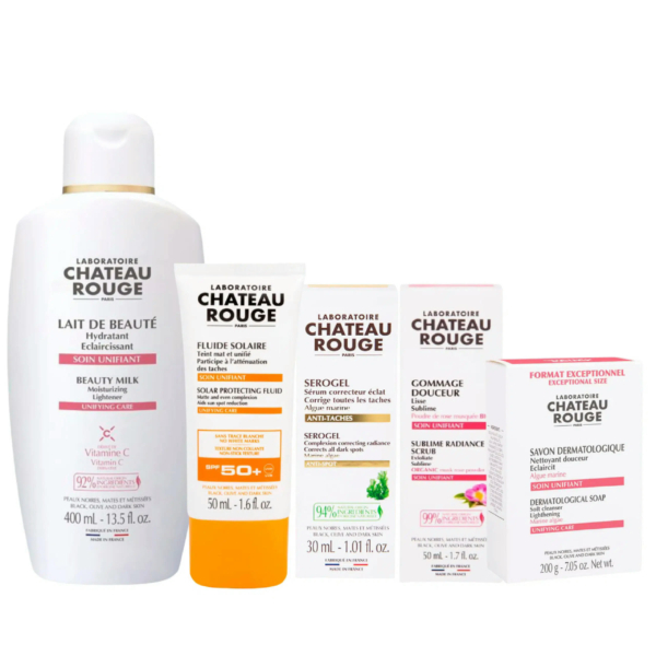 Une collection de cinq produits de soin Château Rouge, dont le Lait de Beauté, le Fluide Solaire Protection, le Serogel, le Gommage Douceur et ßriȇze, présentés sur fond blanc. Chaque produit est présenté dans un emballage coloré orné de textes et de symboles. Dakar