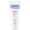 Un tube de lait nourrissant Dexeryl Essentiel, avec un texte en français. Il est censé apaiser et pénétrer rapidement la peau. Le tube est principalement blanc avec un motif bleu clair et rose. Dakar
