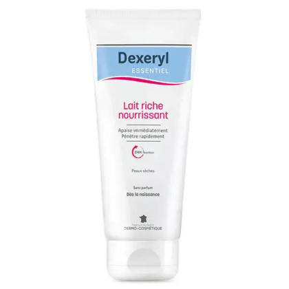 Un tube de lait nourrissant Dexeryl Essentiel, avec un texte en français. Il est censé apaiser et pénétrer rapidement la peau. Le tube est principalement blanc avec un motif bleu clair et rose. Dakar