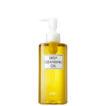 Un flacon d'huile nettoyante profonde DHC avec pompe. Le flacon transparent laisse apparaître l'huile jaune à l'intérieur. L'étiquette avant affiche le nom du produit en gras. Dakar
