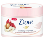 Un pot de gommage exfoliant Dove avec un couvercle rose. L'étiquette présente des graines de grenade et du beurre de karité, ainsi qu'un parfum aux graines de grenade et au beurre de karité. Le logo Dove est bien visible. Dakar