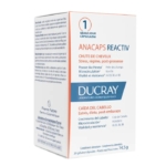 Boîte blanche et bleue du complément alimentaire Ducray Anacaps Reactiv. Le texte, en plusieurs langues, met en avant ses bienfaits, comme la croissance des cheveux et la gestion du stress. Contient 30 gélules et provient des laboratoires Pierre Fabre. Dakar