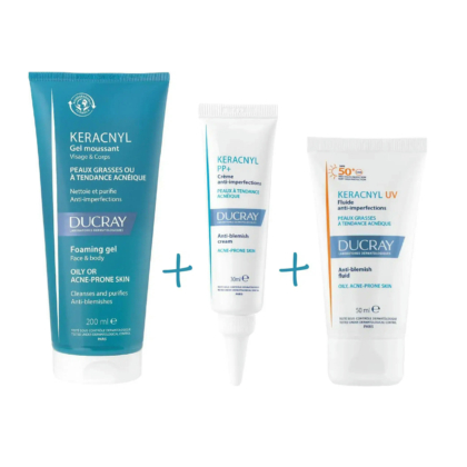 Trois soins pour les peaux à tendance acnéique : un tube bleu de gel moussant Keracnyl, un tube blanc de crème anti-imperfections Keracnyl PP+ et un tube blanc de crème solaire Keracnyl UV SPF 50+, tous signés Ducray. Dakar