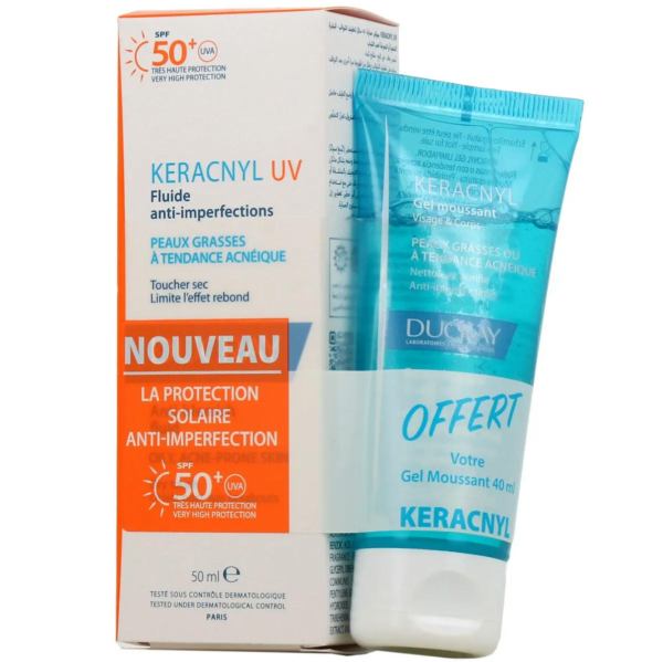 Présentation d'une boîte et d'un tube de crème solaire Ducray Keracnyl UV SPF 50+. La boîte met en avant la protection anti-imperfections pour les peaux grasses à tendance acnéique. Le tube bleu et blanc est étiqueté comme un gel moussant. Dakar