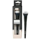 Un pinceau de maquillage au manche noir et aux poils blancs, présenté à l'intérieur et à l'extérieur de son emballage. L'emballage est noir avec une face avant transparente mettant en valeur le pinceau, marqué « ebelin » et étiqueté « Rougepinsel » pour le visage. Dakar