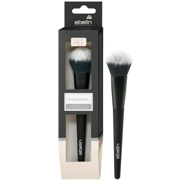Un pinceau de maquillage au manche noir et aux poils blancs, présenté à l'intérieur et à l'extérieur de son emballage. L'emballage est noir avec une face avant transparente mettant en valeur le pinceau, marqué « ebelin » et étiqueté « Rougepinsel » pour le visage. Dakar