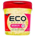 Un pot transparent de gel coiffant à l'huile d'argan Eco Style avec un couvercle rouge. Conçu pour une tenue maximale, ce gel convient à tous les types de cheveux. Il offre brillance, hydratation et soin. Le pot contient 236 ml (8 onces liquides) et est sans alcool. Dakar