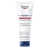 Un tube d'Eucerin Aquaphor Baume Réparateur Cutané 198 g présente un corps blanc et un bouchon bleu avec une étiquette frontale en français et en néerlandais, soulignant son pouvoir de régénération et de réparation des peaux sèches et craquelées. Dakar