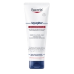Un tube d'Eucerin Aquaphor Baume Réparateur Cutané 198 g présente un corps blanc et un bouchon bleu avec une étiquette frontale en français et en néerlandais, soulignant son pouvoir de régénération et de réparation des peaux sèches et craquelées. Dakar