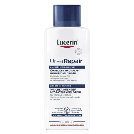 Un flacon blanc de Lotion Réparatrice à l'Urée Eucerin avec un bouchon bleu. L'étiquette présente un texte en français et en néerlandais, soulignant les propriétés hydratantes intenses de sa formule à 10 % d'urée pour les peaux très sèches, ainsi qu'une promesse d'hydratation 72 heures. Dakar