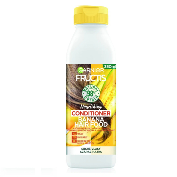 Un flacon de 350 ml d'après-shampoing nourrissant Garnier Fructis Banana Hair Food. L'emballage est principalement blanc avec un bouchon jaune orné d'une image de bananes et de cheveux. Il est étiqueté comme étant d'origine naturelle à 98 %, végan et sans silicone. Dakar