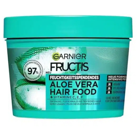 Un flacon bleu sarcelle de soin capillaire Garnier Fructis à l'Aloe Vera avec vitamines C, E et F. Ce produit est étiqueté pour les cheveux normaux à secs, végétalien et biodégradable. Il revendique 97 % d'ingrédients naturels et promet une hydratation intense. Dakar
