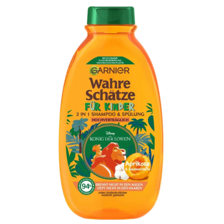 Un flacon orange de Garnier Wahre Schätze pour enfants, orné du motif « König der Löwen » (Le Roi Lion). Ce shampoing et après-shampoing 2 en 1 aux essences d'abricot et de fleur de coton contient 94 % d'ingrédients naturels. Dakar