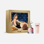 Coffret cadeau Jean Paul Gaultier « Scandal » comprenant une image d'art encadrée d'une femme allongée, un flacon de parfum rose avec un bouchon doré en forme de jambes et un tube de lotion parfumée assorti. Dakar