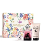 Coffret parfum comprenant un coffret à motifs floraux, un flacon de parfum Guerlain La Petite Robe Noire, un parfum en format réduit et un lait corporel assorti. L'emballage met en valeur des fleurs colorées et le logo Guerlain. Dakar