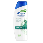 Flacon de shampoing antipelliculaire Head & Shoulders avec bouchon bleu. L'étiquette comporte le texte allemand « Juckende Kopfhaut », qui indique le soulagement des démangeaisons du cuir chevelu. Le design présente une image tourbillonnante et la mention « klinisch getestete », soulignant les tests cliniques. Dakar