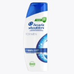 Un flacon blanc et bleu de shampoing Head & Shoulders pour homme. L'étiquette présente un motif de gouttelettes et un texte indiquant qu'il s'agit d'un shampoing antipelliculaire. Dakar