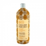 Un flacon de gel douche exfoliant HT26, orné d'une étiquette à motifs circulaires dans les tons marron et beige. L'étiquette indique la présence de noix de coco et de karité. Le flacon contient 1 000 ml de produit. Dakar
