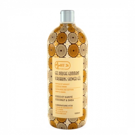 Un flacon de gel douche exfoliant HT26, orné d'une étiquette à motifs circulaires dans les tons marron et beige. L'étiquette indique la présence de noix de coco et de karité. Le flacon contient 1 000 ml de produit. Dakar