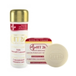 Image des produits de soin HT26 Paris. Comprend une lotion de soin concentrée à l'huile de carotte en flacon et un savon nettoyant purifiant de forme circulaire. Les deux articles sont étiquetés en rouge et blanc. Dakar